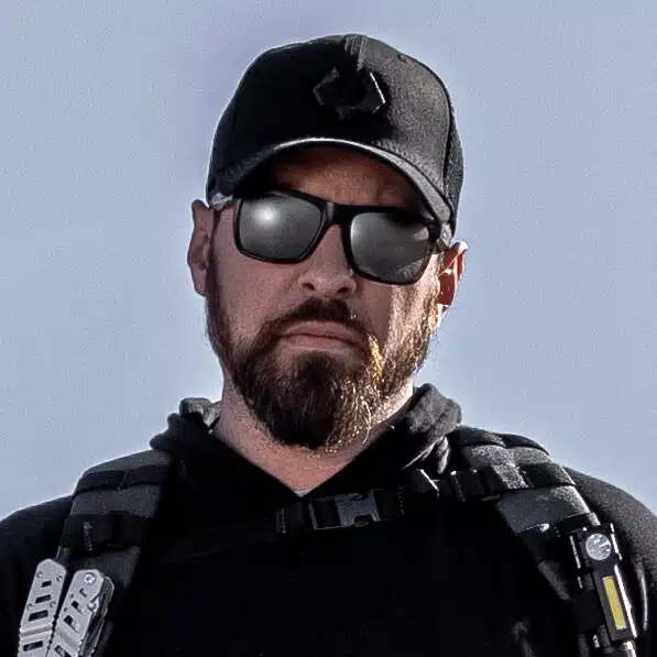 Portrait of Scott Conditt wearing sunglasses and a ball cap